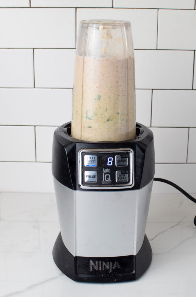 Ninja blender actively blending a mix