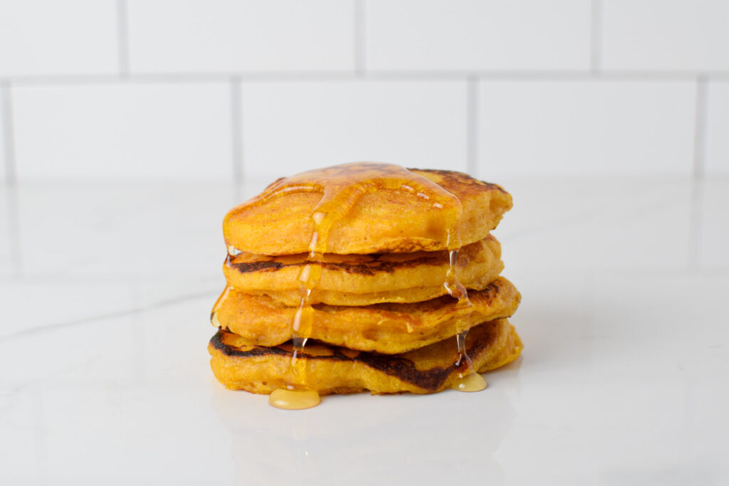 Sourdough Pumpkin Pancakes from scratch in a stack with syrup