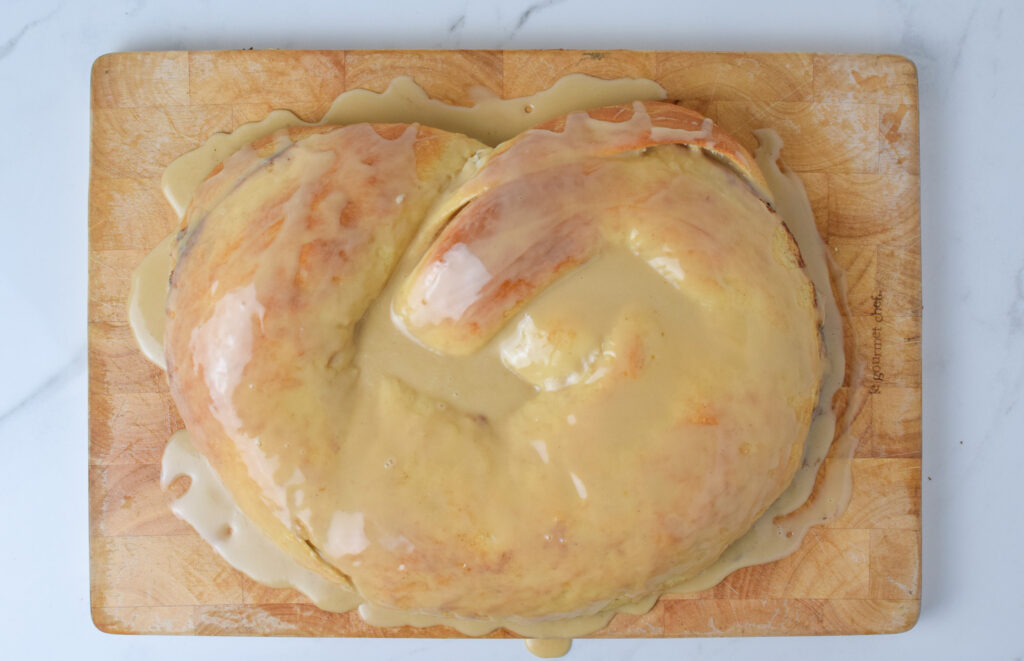 new year's pretzel with maple frosting on a board