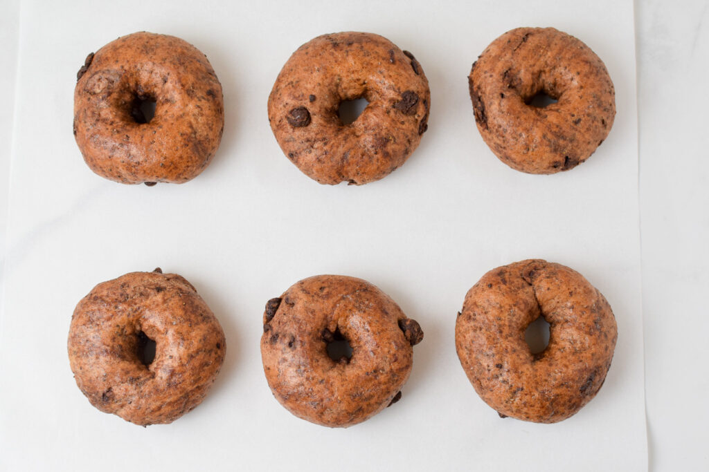 cooked bagels on a baking sheet